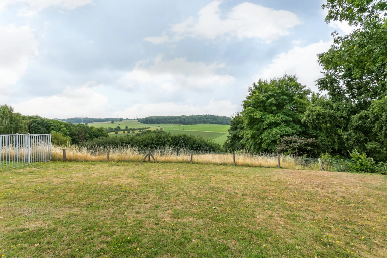 pasture-view-with-dry-grass-and-wooden-fence-limburg